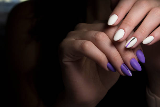 Summer manicure and nail color samples. young woman hands with multicolored